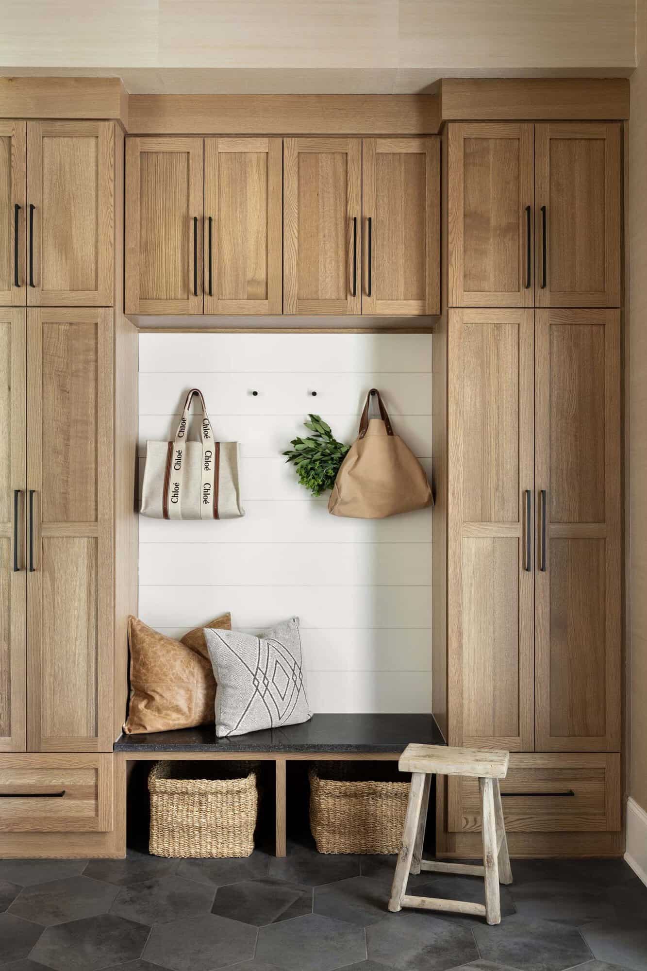 transitional style mudroom with built-in cabinets