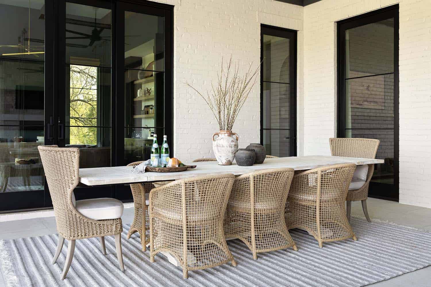 transitional style covered porch outdoor dining table