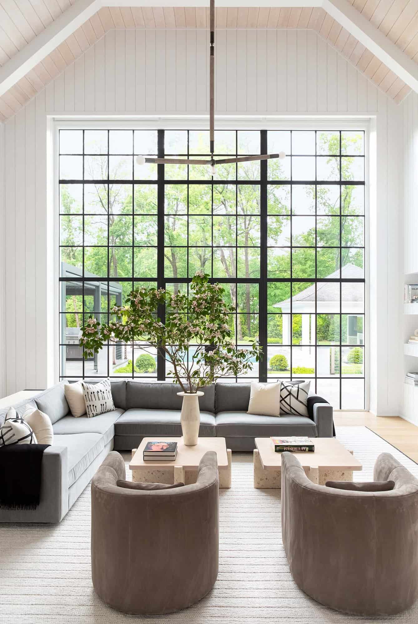 transitional style living room with floor-to-ceiling windows