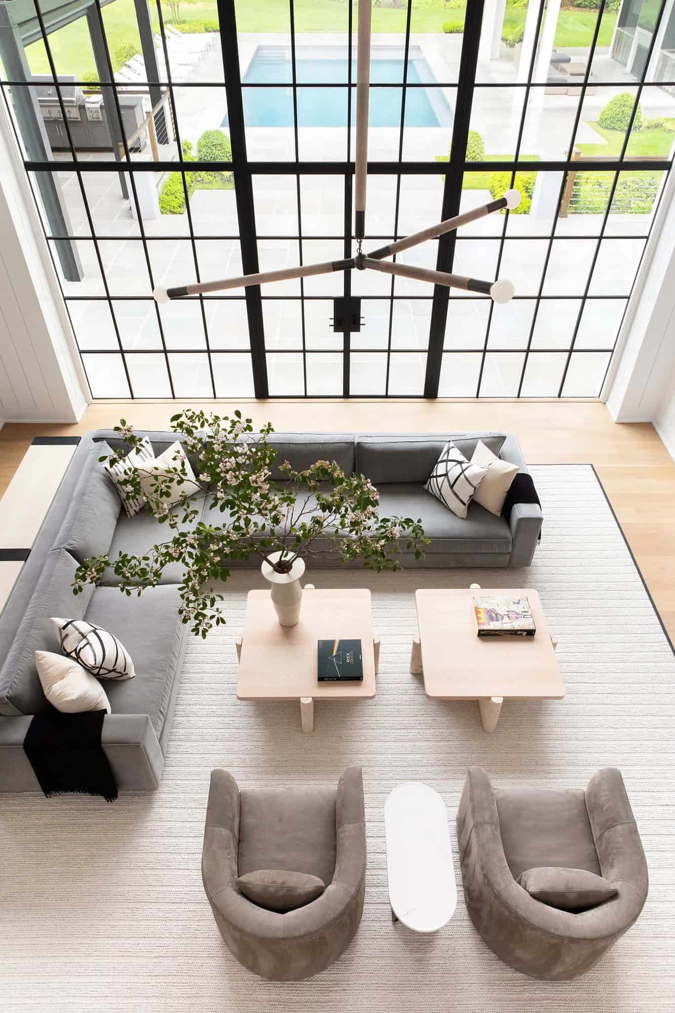 transitional style living room with floor-to-ceiling windows