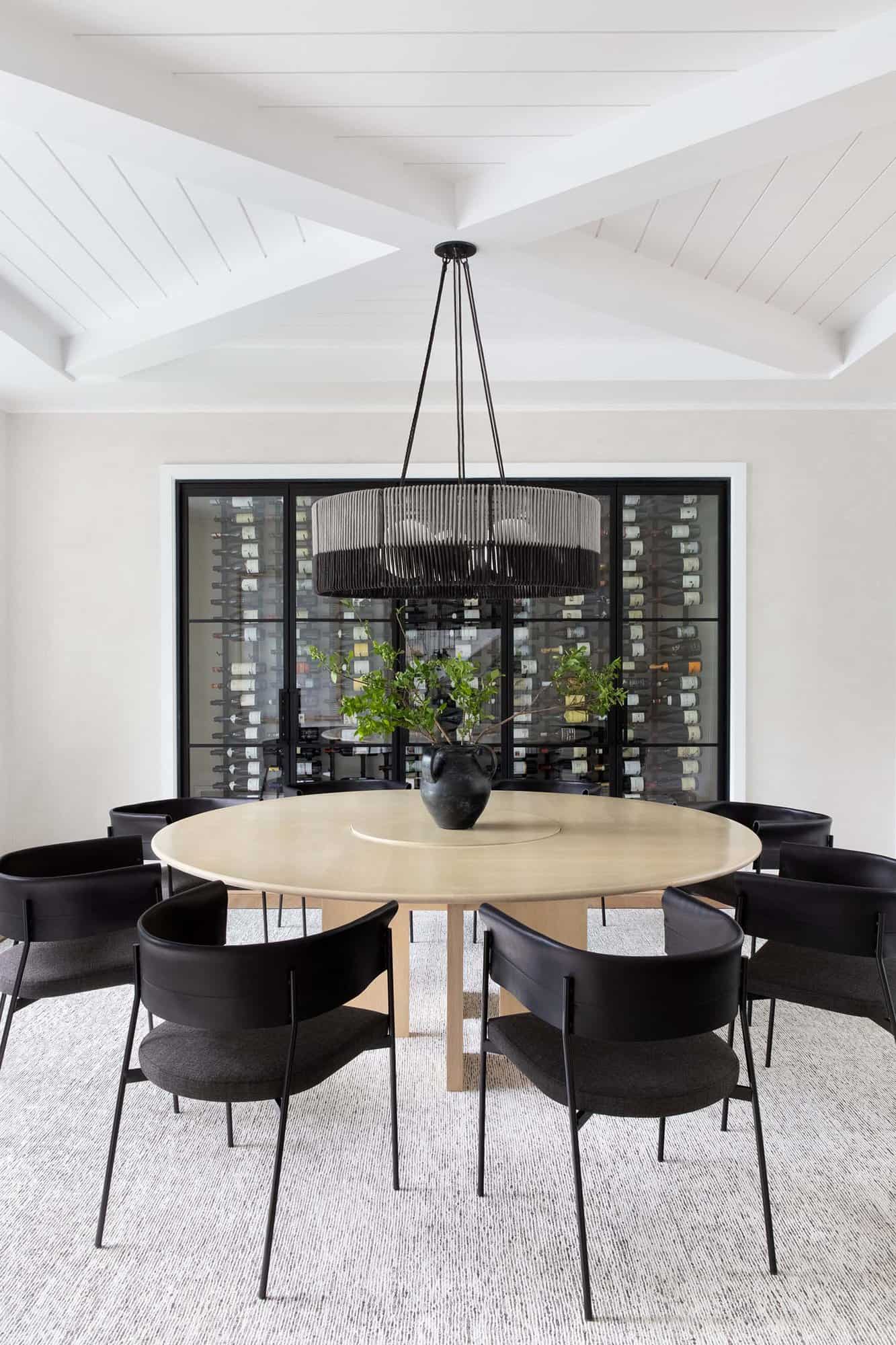 transitional style dining room with a wine cellar