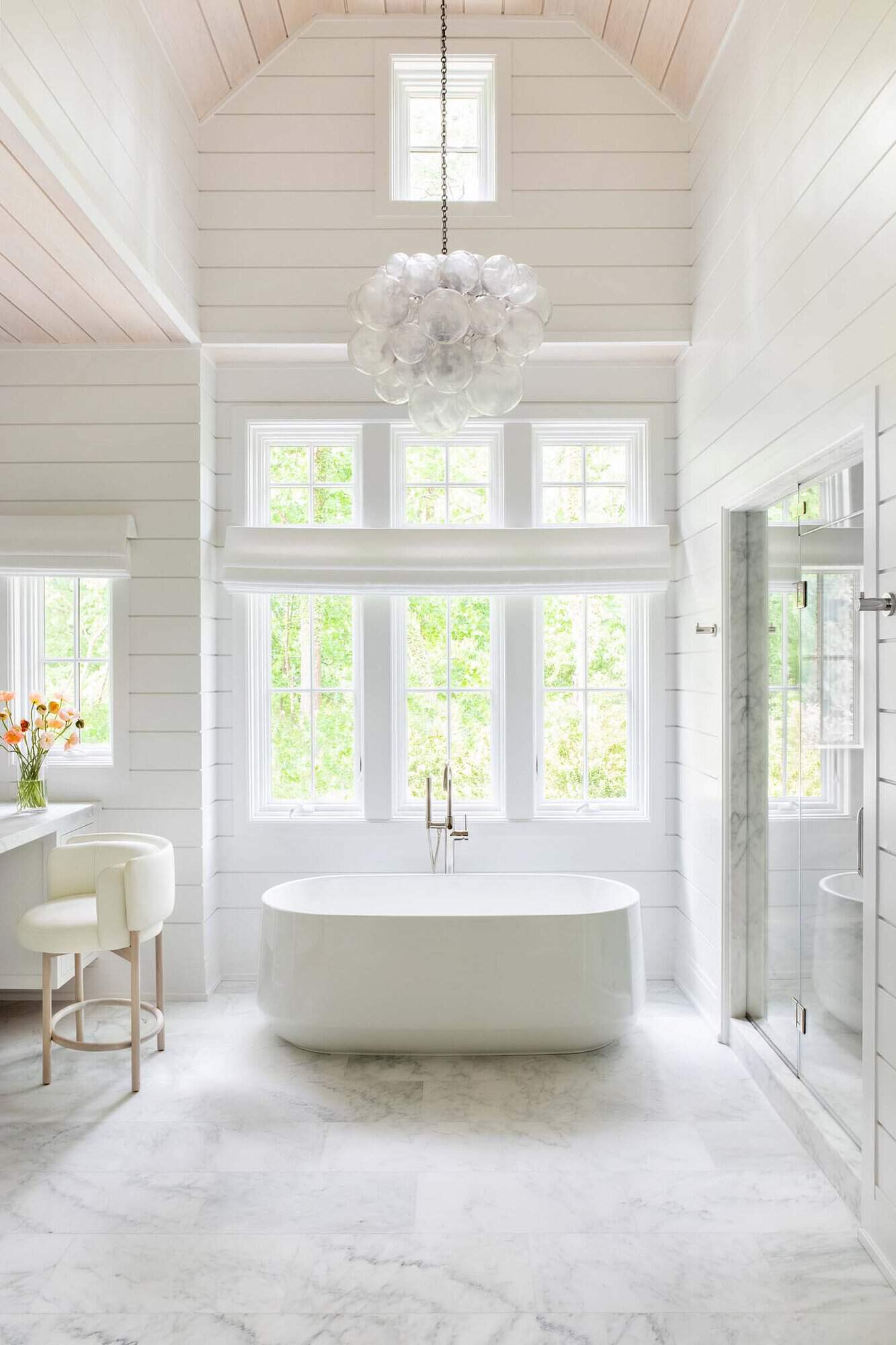 transitional style bathroom with a freestanding tub