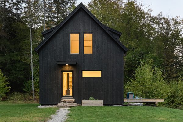 scandinavian style black cabin exterior